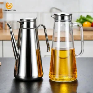 Glass oil jug and stainless steel oil jug on the countertop