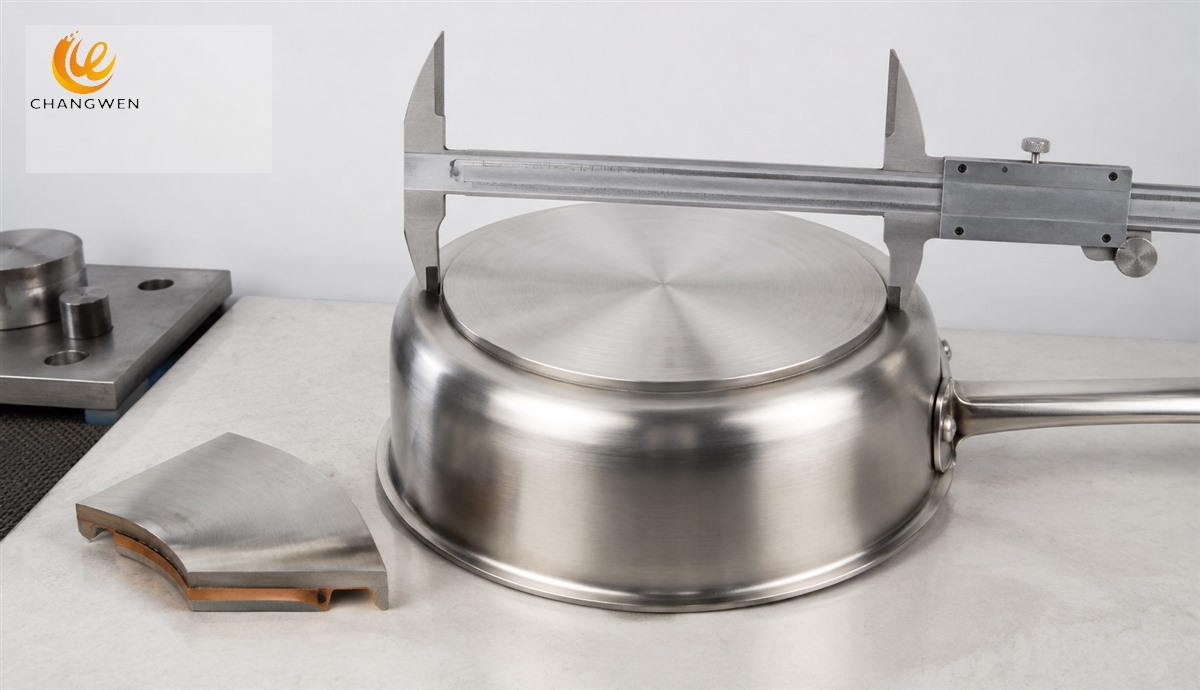 Illustrative caliper measurement across a visible cookware base cover beside a separate section sample